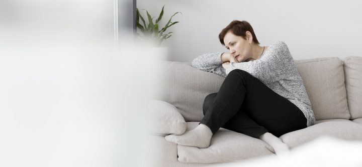 front-view-woman-sitting-couch