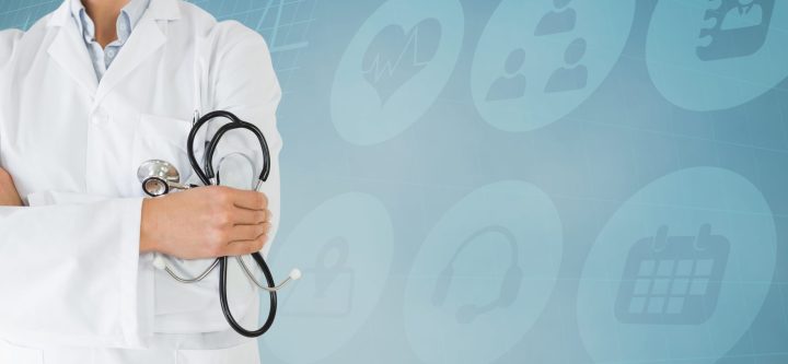 Digital composition of mid section of doctor standing with arms crossed against hospital icons in background